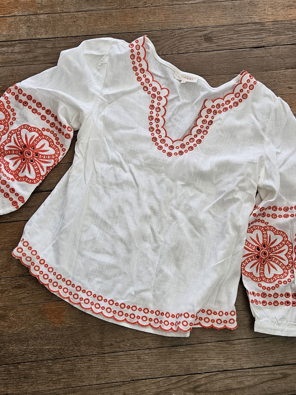 White Embroidered V-Neck Peasant Top with Reddish/Orange Accents